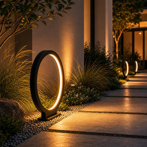 Modern Halo Outdoor Path Light 16 Inch illuminating a garden walkway at night