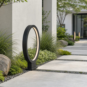 Modern Halo Outdoor Path Light in a daytime garden pathway setting